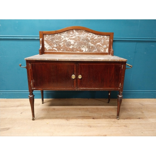 868 - Edwardian mahogany wash stand with marble top and marble gallery back with two blind doors raised on... 