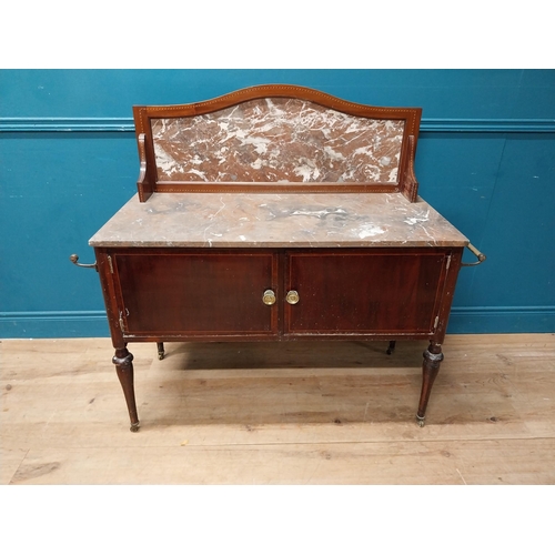 868 - Edwardian mahogany wash stand with marble top and marble gallery back with two blind doors raised on... 