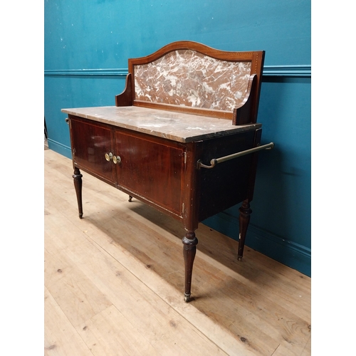 868 - Edwardian mahogany wash stand with marble top and marble gallery back with two blind doors raised on... 