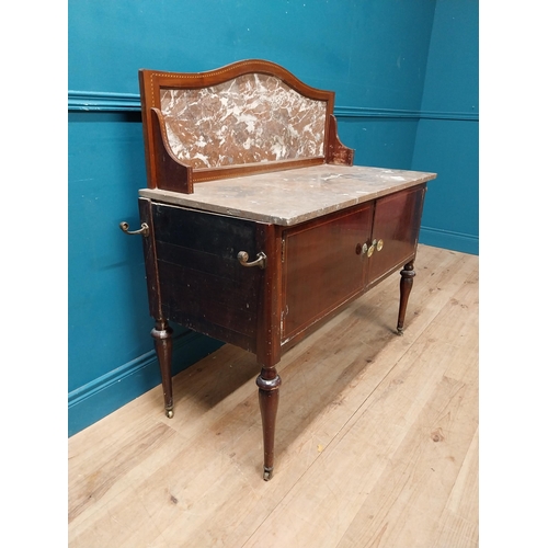 868 - Edwardian mahogany wash stand with marble top and marble gallery back with two blind doors raised on... 