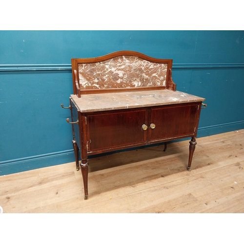 868 - Edwardian mahogany wash stand with marble top and marble gallery back with two blind doors raised on... 