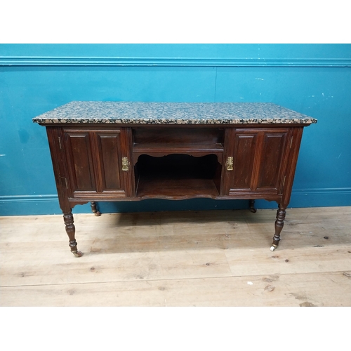 872 - Edwardian mahogany wash stand with marble top raised on turned legs and castors {76 cm H x 123 cm W ... 