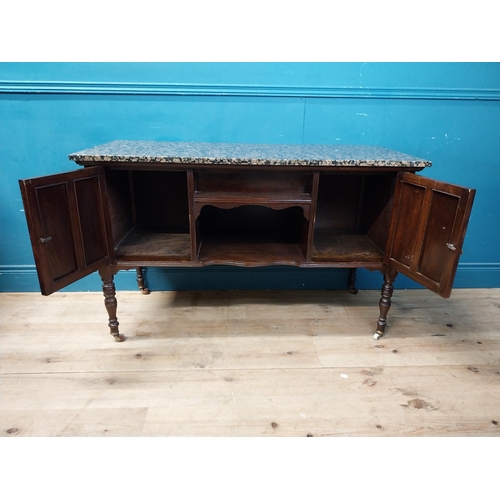 872 - Edwardian mahogany wash stand with marble top raised on turned legs and castors {76 cm H x 123 cm W ... 