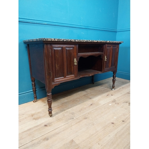 872 - Edwardian mahogany wash stand with marble top raised on turned legs and castors {76 cm H x 123 cm W ... 