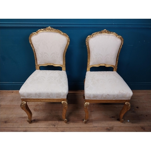 883 - Pair of decorative giltwood chairs in the Victorian style {100 cm H x 50 cm W x 48 cm D}.