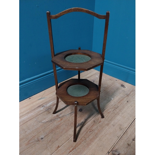 890 - Edwardian mahogany two tiered folding cake stand {60 cm H x 33 cm W x 33 cm D}.