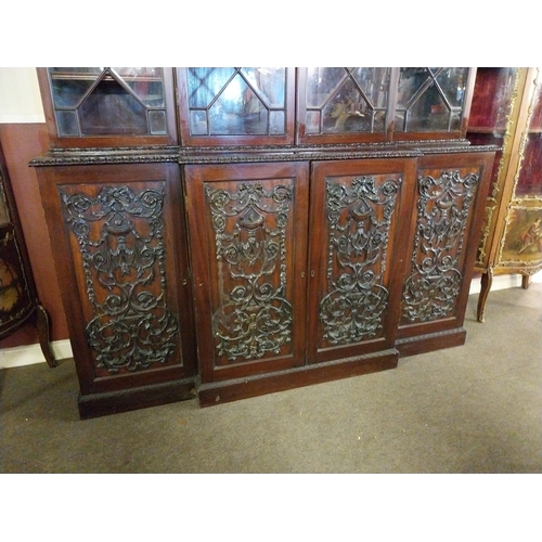 891 - Edwardian mahogany bookcase four astral glazed doors above four carved blind doors in the Adams styl... 