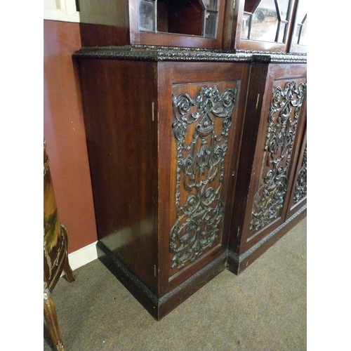 891 - Edwardian mahogany bookcase four astral glazed doors above four carved blind doors in the Adams styl... 