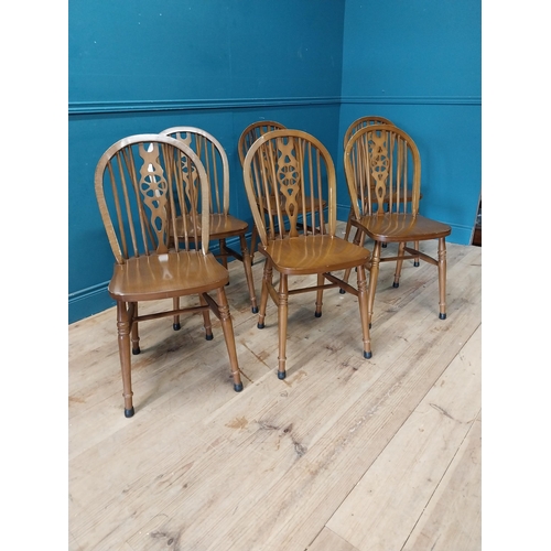 899 - Set of six wheel back kitchen chairs {90 cm H x 40 cm W x 46 cm D}.