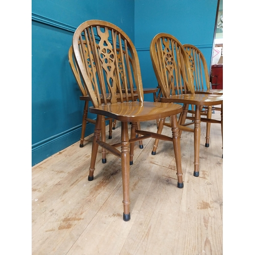 899 - Set of six wheel back kitchen chairs {90 cm H x 40 cm W x 46 cm D}.