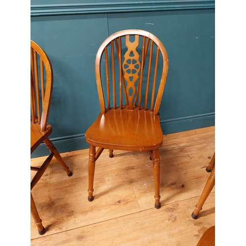 899 - Set of six wheel back kitchen chairs {90 cm H x 40 cm W x 46 cm D}.