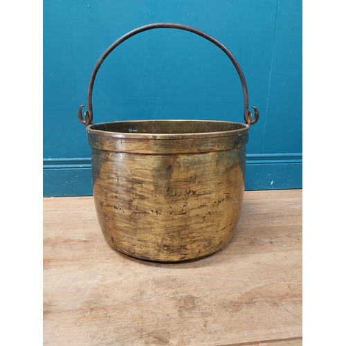 900 - Early 20th C. brass log bucket with wrought iron handle {52 cm H x 47 cm Dia.}.