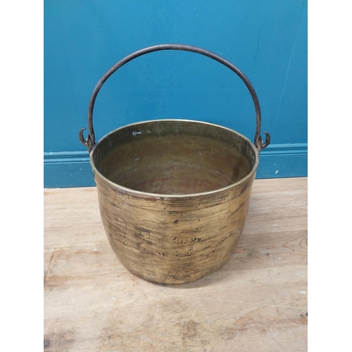 900 - Early 20th C. brass log bucket with wrought iron handle {52 cm H x 47 cm Dia.}.