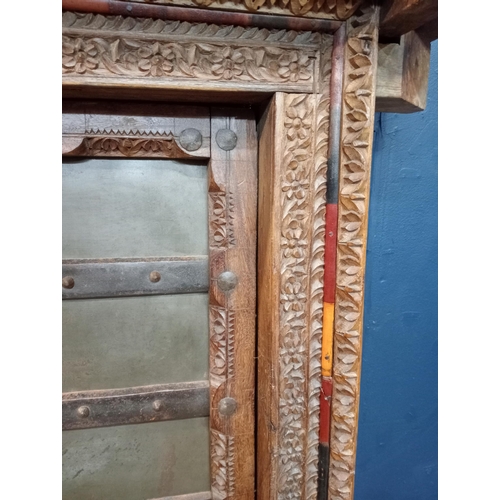 902 - Wooden temple door heavy carved with metal panels and studding {H 180cm x W 120cm x D 40cm }. { not ... 