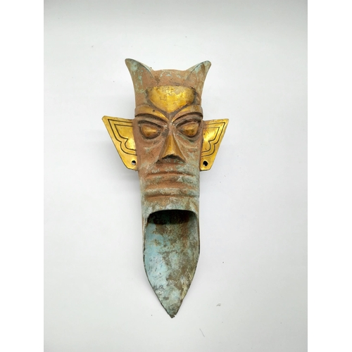 903 - Gilded bronze Tribal mask. {42 cm H x 22 cm W x 14 cm D}.