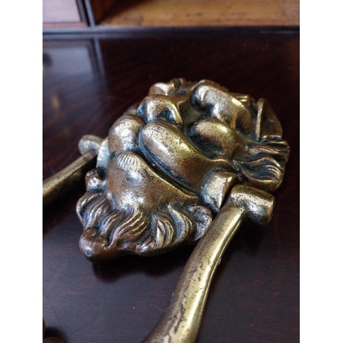 905 - Lions mask brass door knocker {19 cm H}.