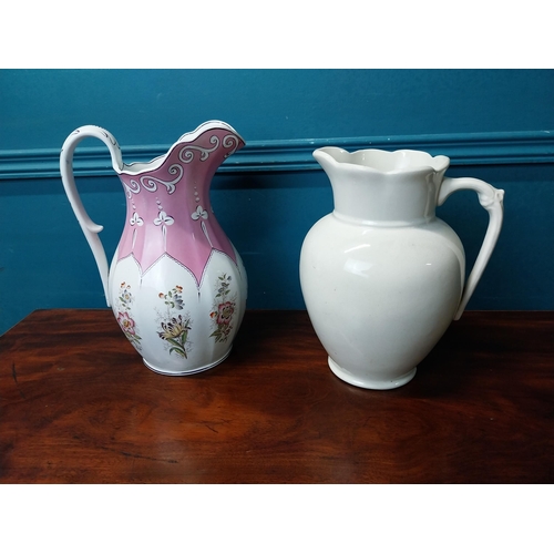 910 - Two early 20th C. ceramic water jugs.