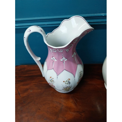 910 - Two early 20th C. ceramic water jugs.