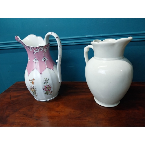 910 - Two early 20th C. ceramic water jugs.