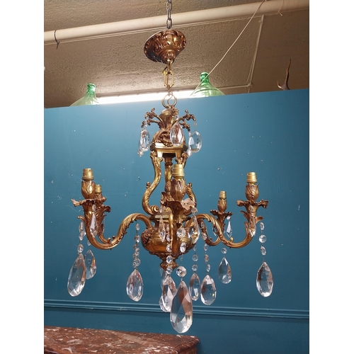 915 - 19th C. gilded brass four branch chandelier. {97 cm H x 65 cm Dia.}.