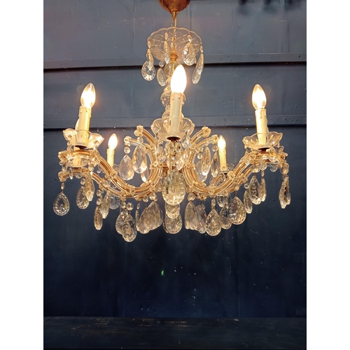 92 - Brass and crystal eight branch chandelier {H 90cm x Dia 70cm}. { not on site for viewing }.