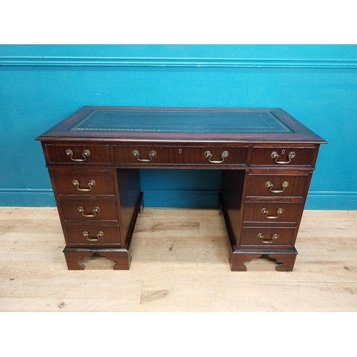 923 - Mahogany pedestal desk with tooled leather top and eight short drawers and single drawer in frieze r... 