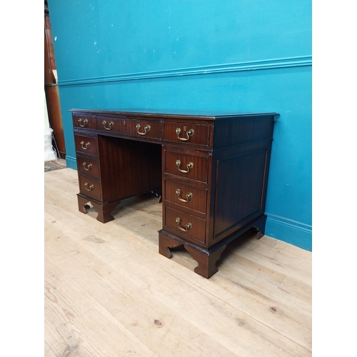 923 - Mahogany pedestal desk with tooled leather top and eight short drawers and single drawer in frieze r... 