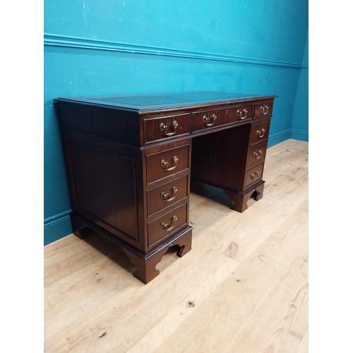 923 - Mahogany pedestal desk with tooled leather top and eight short drawers and single drawer in frieze r... 