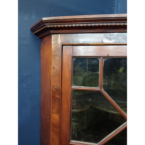 930 - Walnut veneered hanging corner cabinet with astral glazed door {H 107cm x W 68cm x D 43cm }. { not o... 