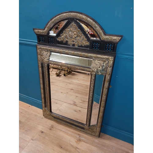 931 - 19th C. French brass and ebonised cushion mirror with floral decoration. {131 cm H x 86 cm W}.