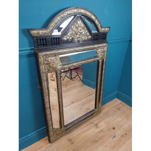 931 - 19th C. French brass and ebonised cushion mirror with floral decoration. {131 cm H x 86 cm W}.