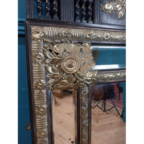 931 - 19th C. French brass and ebonised cushion mirror with floral decoration. {131 cm H x 86 cm W}.