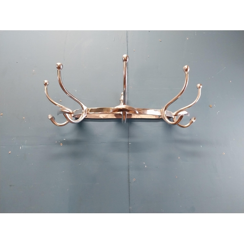 932 - Chrome coat rack {19 cm H x 65 cm W x 34 cm D}.