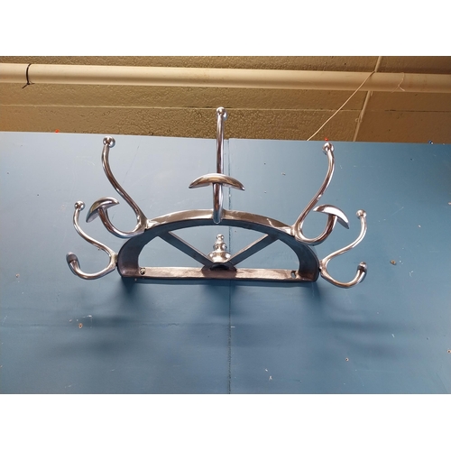 932 - Chrome coat rack {19 cm H x 65 cm W x 34 cm D}.