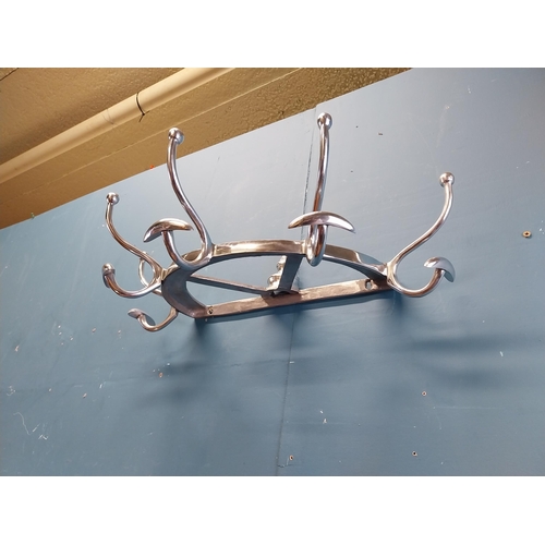 932 - Chrome coat rack {19 cm H x 65 cm W x 34 cm D}.