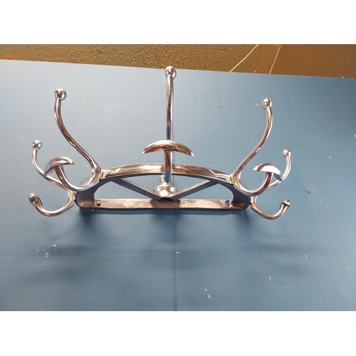 932 - Chrome coat rack {19 cm H x 65 cm W x 34 cm D}.