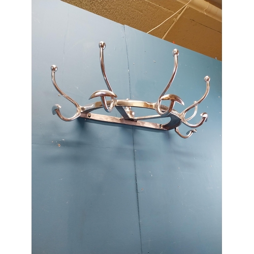 932 - Chrome coat rack {19 cm H x 65 cm W x 34 cm D}.