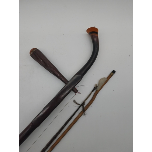 935 - Xinghai Chinese violin and bow. {82 cm L x 13 cm W x 10 cm D}.