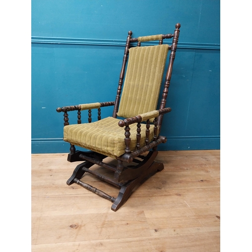 937 - Edwardian mahogany and upholstered rocking chair {112 cm H x 58 cm W x 68 cm D}.