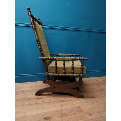 937 - Edwardian mahogany and upholstered rocking chair {112 cm H x 58 cm W x 68 cm D}.