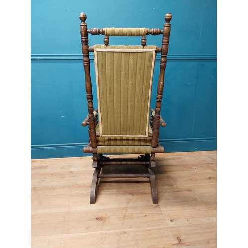 937 - Edwardian mahogany and upholstered rocking chair {112 cm H x 58 cm W x 68 cm D}.