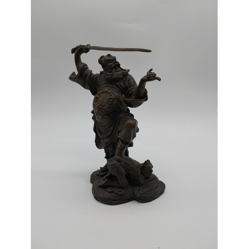 938 - Bronze model of Oriental warrior. {26 cm H x 19 cm W x 12 cm D}.