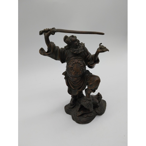 938 - Bronze model of Oriental warrior. {26 cm H x 19 cm W x 12 cm D}.