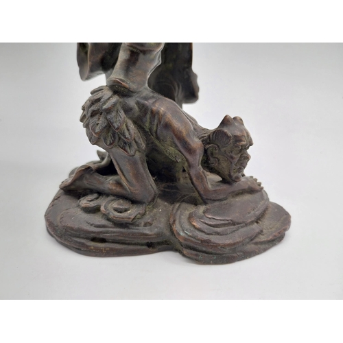 938 - Bronze model of Oriental warrior. {26 cm H x 19 cm W x 12 cm D}.