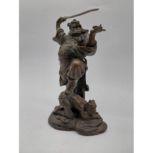 938 - Bronze model of Oriental warrior. {26 cm H x 19 cm W x 12 cm D}.