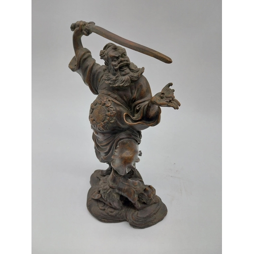 938 - Bronze model of Oriental warrior. {26 cm H x 19 cm W x 12 cm D}.