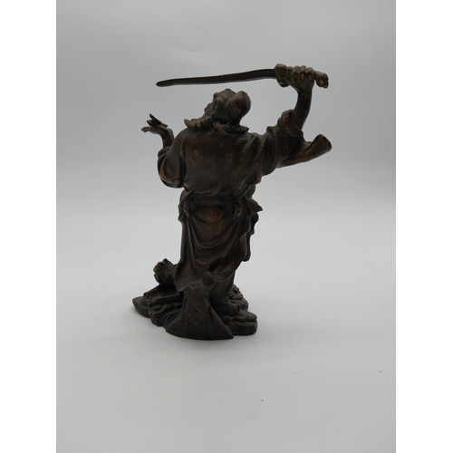 938 - Bronze model of Oriental warrior. {26 cm H x 19 cm W x 12 cm D}.