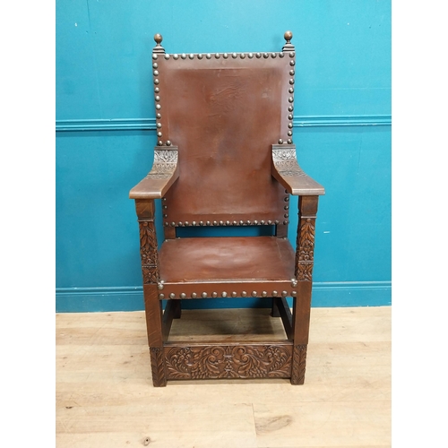 947 - Edwardian carved oak and leather upholstered throne chair. {165 cm H x 63 cm W x 55 cm D}.