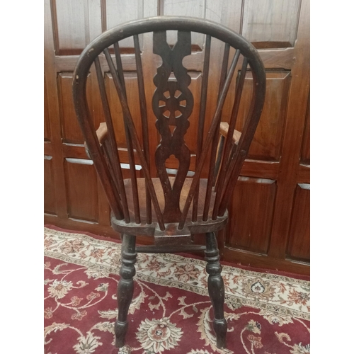 953 - Oak Windsor spindle armchair{H 100cm x W 53cm x D 50cm }. { not on site for viewing }.