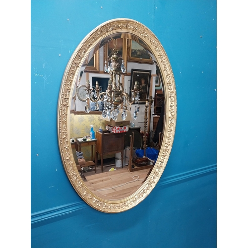 956 - 19th C. gilt oval wall mirror. {96 cm H x 68 cm W}.